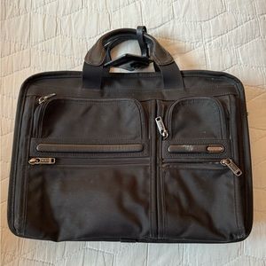 TUMI Laptop Bag with leather shoulder strap and suitcase loop